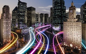 Glowing light trails surround the smart city